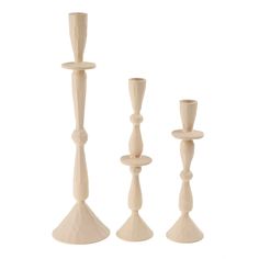 three wooden candlesticks on a white background