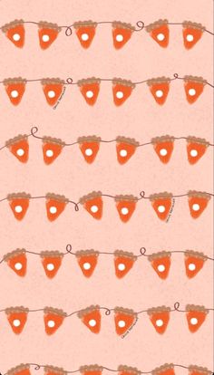 an orange and white wallpaper with hearts on the clothes line, which reads love is in the air