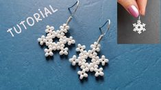 the snowflake earrings are made out of beads