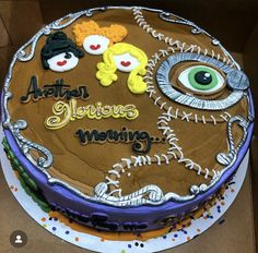 a birthday cake decorated with an eye and some words on the top that says, ahotan alvins meowing