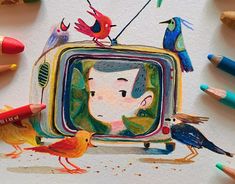 some crayons and colored pencils are surrounding a drawing of a tv with birds on it