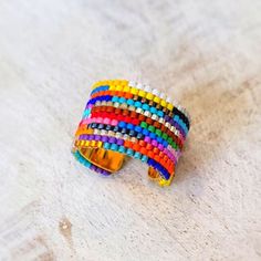 a multicolored ring sitting on top of a table