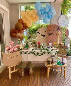 an outdoor party with balloons and decorations