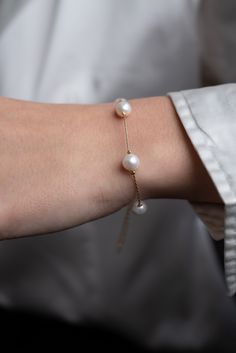 *FRESHWATER REAL PEARL STATION BRACELET* Floating pearl bracelet  designed from round shaped real freshwater pearls and 22k gold plated cobra chain, which will accompany you with its nobility in an elegant invitation and you can never give up in your daily routine. *MATERIAL : High quality 22k gold plated over brass Cobra chain (0.8mm) High quality round shaped freshwater pearls (8mm) *SIZE GUIDE : You can reach the size you want from the bracelet  length option. If there is a special size you w Formal Pearl Bracelet With Adjustable Chain, White Pearl Bracelet With Adjustable Chain, Classic Pearl Bracelets With Adjustable Chain, White Pearl Chain Round Bracelets, Pearl White Pearl Chain Bracelet, Formal Pearl Bracelets With Adjustable Chain, Pearl White Round Bracelets With Pearl Chain, Minimalist Round Pearl White Bracelet, Formal Pearl Chain Bracelet