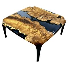 a wooden table with black and gold wood inlays on it's sides