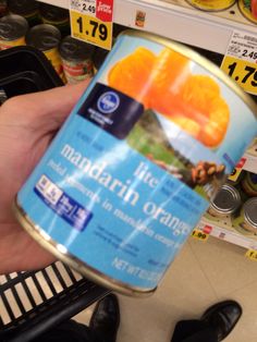 a can of mandarin orange juice in a store