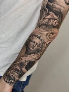 a man with a tattoo on his arm that has an image of the virgin mary