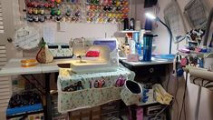 a sewing studio with lots of crafting supplies