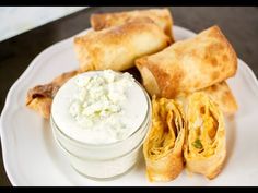 a white plate topped with pastries and dip