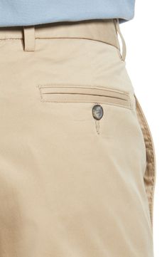 Crisp and classic, these flat-front khakis made of cotton twill sport a touch of stretch that moves across your entire casual wardrobe. 16" leg opening; 10 3/4" front rise 97% cotton, 3% spandex Machine wash, tumble dry Imported Cotton Chinos With 5-inch Inseam And Pockets, Classic Relaxed Fit Cargo Pants In Chino Cotton Twill, Classic Chino Cotton Twill Cargo Pants With Welt Pockets, Classic Chino Cotton Twill Cargo Pants With Pockets, Business Casual Chino Cotton Twill Cargo Pants, Business Casual Chino Cotton Twill Cargo Pants With Pockets, Business Casual Cotton Cargo Pants With Side Pockets, Cotton Cargo Pants For Business Casual, Classic Bottoms With Comfort Waistband