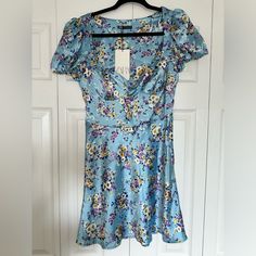 Zara Mini Satin Floral Dress. Never Worn . Size M Fitted Blue Floral Dress For Garden Party, Blue Floral Print Feminine Dress, Fitted Blue Floral Summer Dress, Blue Fitted Floral Dress For Summer, Fitted Blue Floral Dress For Summer, Casual Blue Floral Dress For Party, Light Blue Fitted Feminine Dress, Blue Knee-length Floral Party Dress, Casual Blue Floral Party Dress