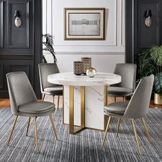 a dining room table with chairs around it and a rug in front of the table