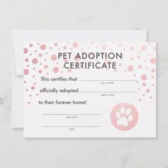 a pet adoption certificate is shown on a marble surface with pink and white polka dots