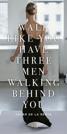 a woman in a black dress with the words walk like you have three men walking behind you