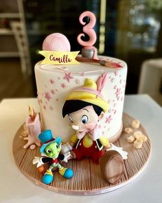 a birthday cake with an image of a cartoon character on it