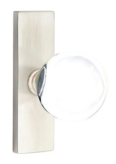 a white door handle with a round glass knob