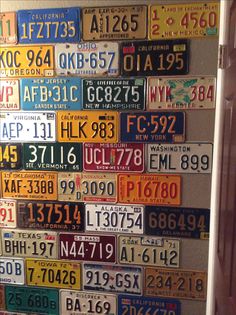 many different license plates are arranged on the wall in this art work that is made out of old license plates