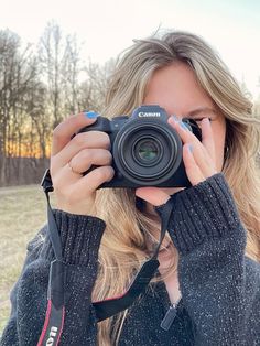 a woman taking a photo with her camera