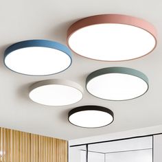 three circular lights are hanging from the ceiling