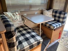 the inside of an rv with checkered cushions