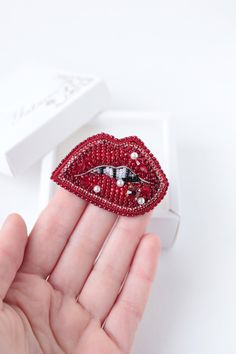 "Kiss me jewelry it is embroidered brooch by bead and gimp. Bridal Pin is a trendy item. Kiss me charm has a size 2.2*1.4 inches (5,5*3,5 cm). This lips wedding pin can be made with different crystals or charms according to your order. Red lips brooch - kiss me jewelry with Czech crystal beads. It will perfectly complement your unique jewelry collection or will be a wonderful gift for a special person. It can be used as a bridal brooch. Looks very elegant! Kiss brooch is carefully bead embroider Red Enamel Brooch Pin For Gift, Red Brooch Pins For Valentine's Day, Red Beaded Brooch For Party, Lips Pin, Jewelry Valentines Day, Bridal Brooch, Embroidered Brooch, Wedding Pins, Czech Crystal