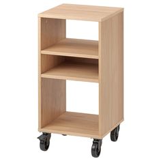 a small wooden shelf on wheels with two shelves