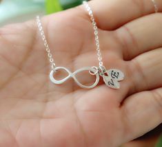 Sterling silver infinity symbol necklace with custom initials.  Infinity love for best friends, family, bridesmaids, or just for yourself. Great gift and everyday necklace. Available in silver, gold and rose gold. Details: 1. Infinity charm: .925 sterling silver . About 20x8 mm 2. Chain and clasp: .925 sterling silver 3. Leaf charms: high qualitywhat gold plated. Hand stamped letters of your choice. 4. Length of necklace: 17'' end to end. Please select your favorite length from the drop down men Infinity Symbol Necklace, Friendship Necklace, Infinity Charm, Infinity Love, Symbol Necklace, Necklace Initial, Friendship Necklaces, Tree Necklace, Infinity Symbol