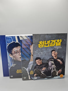 three dvd's with korean characters on them sitting in front of a white background