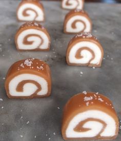 several pieces of food that are sitting on a table together with icing and powdered sugar