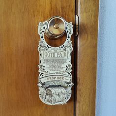 a door handle with an advertisement for the bath fair on it's front and side