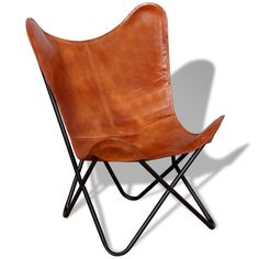 a brown leather chair sitting on top of a black metal frame legs and armrests