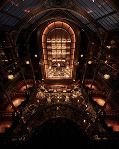 an overhead view of a library with many books on the shelves and lights in the ceiling