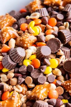 a bowl filled with candy and nuts on top of a table