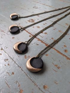 Simple little moons in the dark of night. Made from polymer clay. 20 inch chain. Black Crescent Necklaces As Gift, Black Crescent Necklaces For Gift, Minimalist Black Moon Necklace, Black Moon Phase Round Pendant Necklace, Black Round Necklace With Moon Charm, Black Necklace With Moon Charm, Handmade Black Moon Necklace, Black Crescent Moon Charm Necklace, Moon Clay