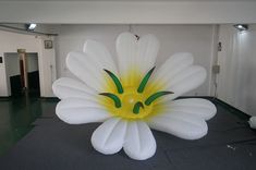 an inflatable flower is sitting on the floor