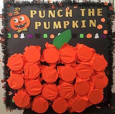 a bulletin board with pumpkins on it and the words punch the pumpkin written in large letters