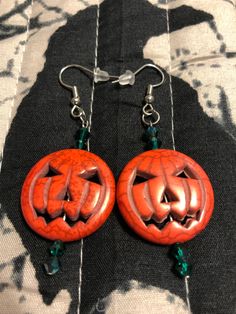 Spooky Halloween stone pumpkin dangle earrings with green emerald beads.  Earrings measure  approximately 2" long. Jewelry organza bag included, comes with clear protection bag as well for storage and is tarnish resistant if kept in clear bag.  Earring hooks are made of sterling silver material, free of nickel and lead, does not cause allergic reactions, does not fade, safe and durable, with clear backings. Free Shipping Stone Pumpkin, Halloween Costume Jewelry, Spooky Earrings, Jack O Lantern Pumpkin, Protection Bag, Earrings Halloween, Halloween Jack O Lanterns, Emerald Bead, Halloween Jack