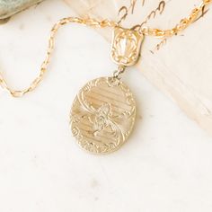 This one-of-a-kind necklace is composed of: Victorian watch fob connector and locket from the late 1800s with the locket showing hand-engraved floral and scroll-work details on both front and back of locket. This necklace measures a standard 18” on a modern 14k gold filled chain. The locket measures 1.25" in height, 1" in width and drops 2.25" from chain. Victorian Watch, Victorian Locket, Oval Locket, Scroll Work, Signature Jewelry, Charm Rings, Victorian Jewelry, Bracelets And Charms, Gold Filled Chain