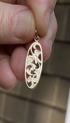 Fourteen karat solid yellow gold filigree pendant is an elongated oval shape measuring 28mm (without ring) by 9mm wide. A substantial piece yet very delicate. Price does not include chain. 1.9g. Money back guarantee within 14days. Buyer pays return shipping and must be returned in original condition with box and no alterations. Gold Filigree Oval Link Jewelry, Yellow Gold Oval Pendant With Intricate Design, 14k Gold Filigree Flower Pendant Jewelry, Oval Yellow Gold Filigree Jewelry, Elegant Etched Oval Jewelry, Elongated Oval, Filigree Pendant, Gold Filigree, Solid Yellow