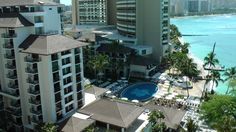 an aerial view of the pool and surrounding buildings in waikiki, oahu