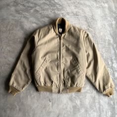 Vintage Linen OshKosh Bomber Jacket  - USA - Size 40R-M? (look on measurements) - Condition: Very good, some small stains, need wash (photo incl.)  Measurements : cm/in * chest 60/23.62 * length 63/24.8 * shoulders 48/18.9 * sleeve length 62/24.41 * hem 41/16.14  Questions? fill free to ask * no refund !IMPORTANT! information about delivery: fill free to ask about express delivery before order   * Please note that all clothes which I sell are vintage or used and may have signs of imperfection, w Vintage Outerwear With Zip Fly For Fall, Fitted Khaki Cotton Outerwear, Vintage Fall Outerwear With Zip Fly, Vintage Beige Outerwear For Streetwear, Retro Solid Cotton Outerwear, Vintage Oshkosh, Vintage Linen, Vintage Linens, Mens Jackets