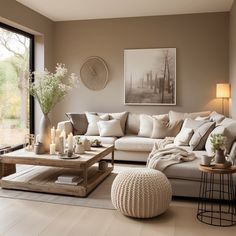 a living room filled with lots of furniture and decor on top of a hard wood floor