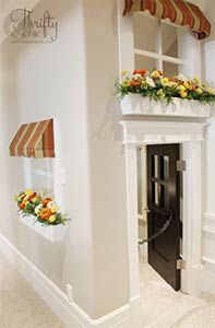 a white fireplace with flowers in the window boxes