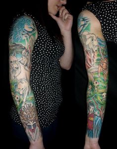 two women with tattoos on their arms and arm sleeves, one is holding her hand to her face