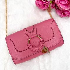 See By Chlo Hana Continental Leather Purse In Pushy Pink -Brand New With Tags -Comes With Authentication Certificate -Can Be Used As A Crossbody Or A Wallet -Dimensions: Approximately 7.5"W X 1.25"D X 4.5"H -Snap Flap Closure -Interior Zip Pocket, Interior Card Slot -Gold-Tone Hardware -Signature Ring Hardware And Charm Details At Front -Embossed Logo At Front -Cotton Canvas Lining -Leather -Made In India Pink Leather Crossbody Clutch, Chic Pink Wallet On Chain With Chain Strap, Chic Pink Crossbody Wallet, Pink Evening Wallet On Chain With Chain Strap, Signature Ring, Signature Rings, Pink Purse, Pink Brand, See By Chloe