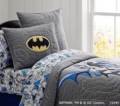 a batman bed set with blue and gray sheets