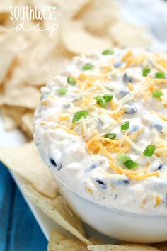 a white bowl filled with blue cheese and chips