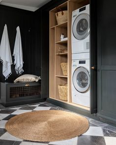 the laundry room is clean and ready to be used as a washer and dryer