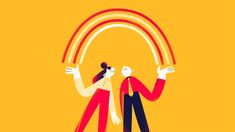 two people standing next to each other in front of a yellow background with a rainbow