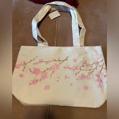 Nwt Tote Bag. Cherry Blossom Print. Inside Bag Is Lined In Pink With Zippered Pocket. Beautiful Bag Large Capacity Canvas Bag For Spring, White Canvas Bag For Spring, Pink Cotton Shoulder Bag For Spring, Spring Pink Cotton Shoulder Bag, Spring Shopping Canvas Bag, Spring Canvas Shopping Bag, Spring Travel Canvas Bag, Spring Pink Bags With Large Capacity, Large Capacity Pink Bags For Spring